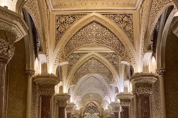 Stunning Gothic arches and detailed carvings inside Monserrate Palace during the Sintra & Cascais tour.