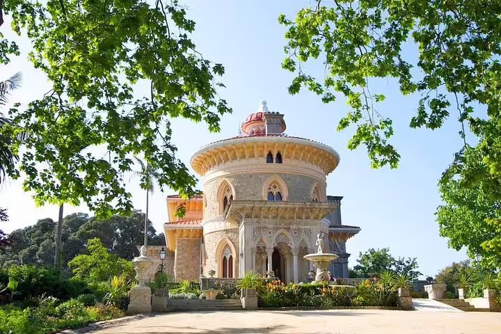 Monserrate Palace surrounded by lush greenery, featured in a private tour from Lisbon to Sintra's Pena and Regaleira palaces.