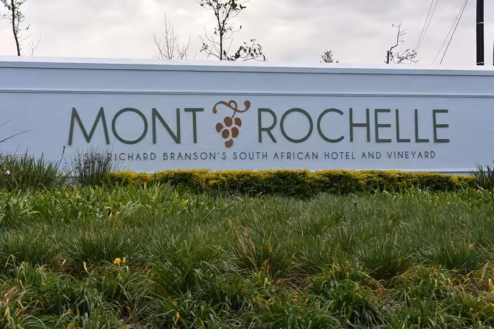 Mont Rochelle vineyard sign in Franschhoek, South Africa, highlighting luxury wine experiences from Cape Town tours.