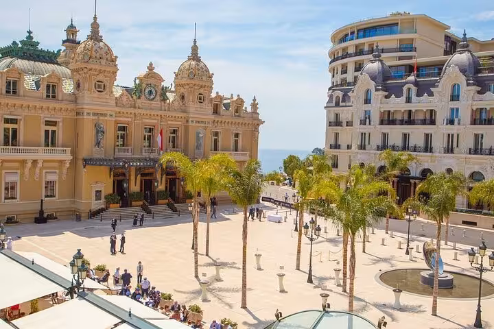 Elegant Monte Carlo Casino and square lined with palm trees, a must-see on the Monaco Monte-Carlo private tour.
