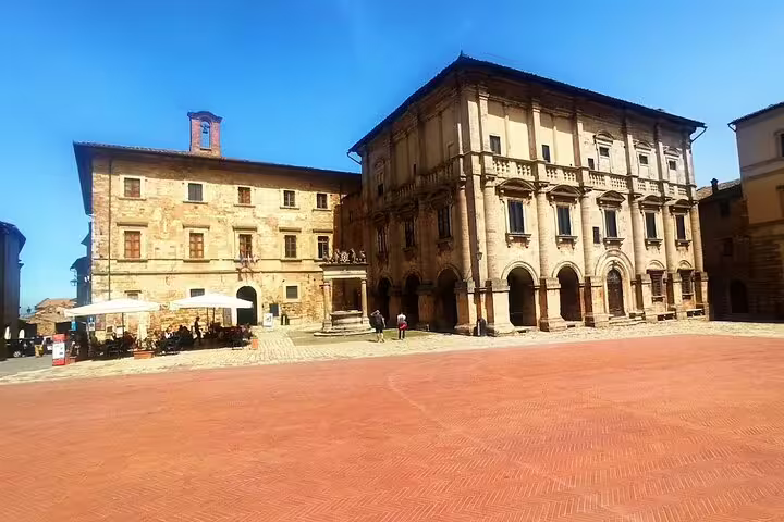 Sunlit Piazza Grande with Renaissance palaces in Montepulciano, a scenic stop on the private Brunello and Nobile wine tour