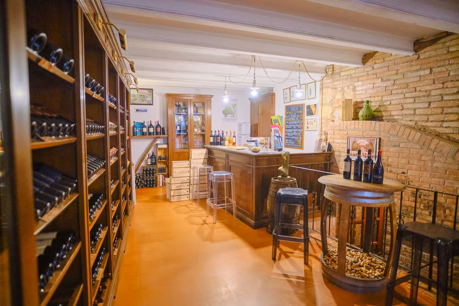 Charming wine shop interior in Montepulciano featuring rustic wooden shelves stocked with premium Italian wines.