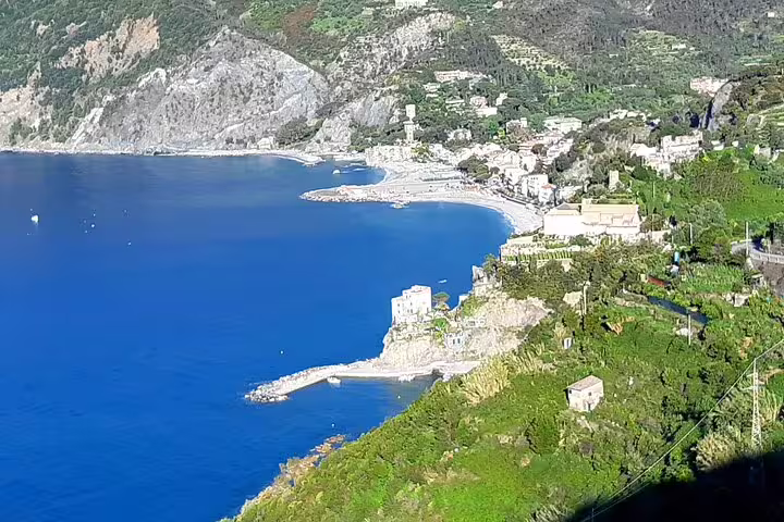 Panoramic view of Monterosso al Mare coastline with turquoise Ligurian Sea on a La Spezia to Cinque Terre day trip