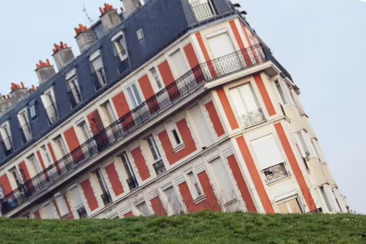 Colorful Parisian apartment building on a Montmartre hill, a photo stop on a self-guided scavenger hunt walking tour