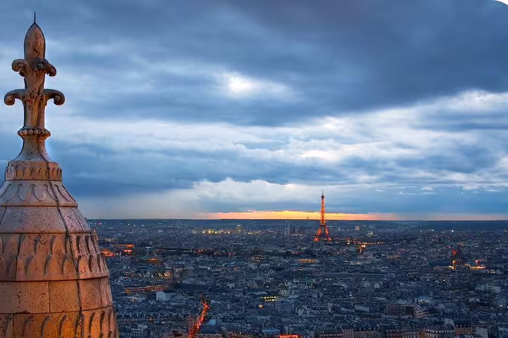 Paris skyline from Montmartre viewpoint with Eiffel Tower at sunset on a self-guided scavenger hunt tour