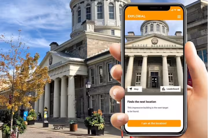 Phone app guides players at Marché Bonsecours during a Montréal scavenger hunt and city highlights walking tour