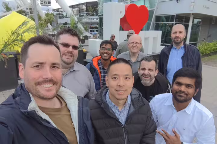 Group photo at I Love MTL sign during Montréal scavenger hunt and city highlights walking tour downtown
