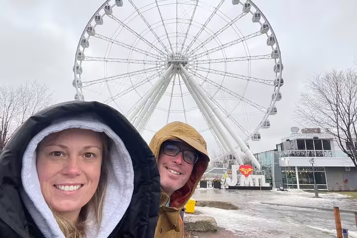 Winter Montréal scavenger hunt photo near La Grande Roue Ferris wheel in Old Port, city highlights walk