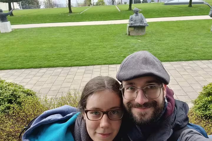 Couple selfie in Montreux lakeside park, ideal for a self-guided scavenger hunt and sights tour in Switzerland