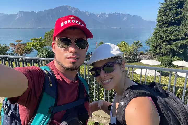 Couple selfie with Lake Geneva and Alps on Montreux scavenger hunt and sights self-guided walking tour
