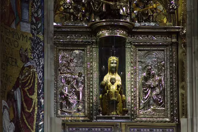 Intricate golden and silver altar featuring the Black Madonna at Montserrat Monastery, a cultural and spiritual icon.
