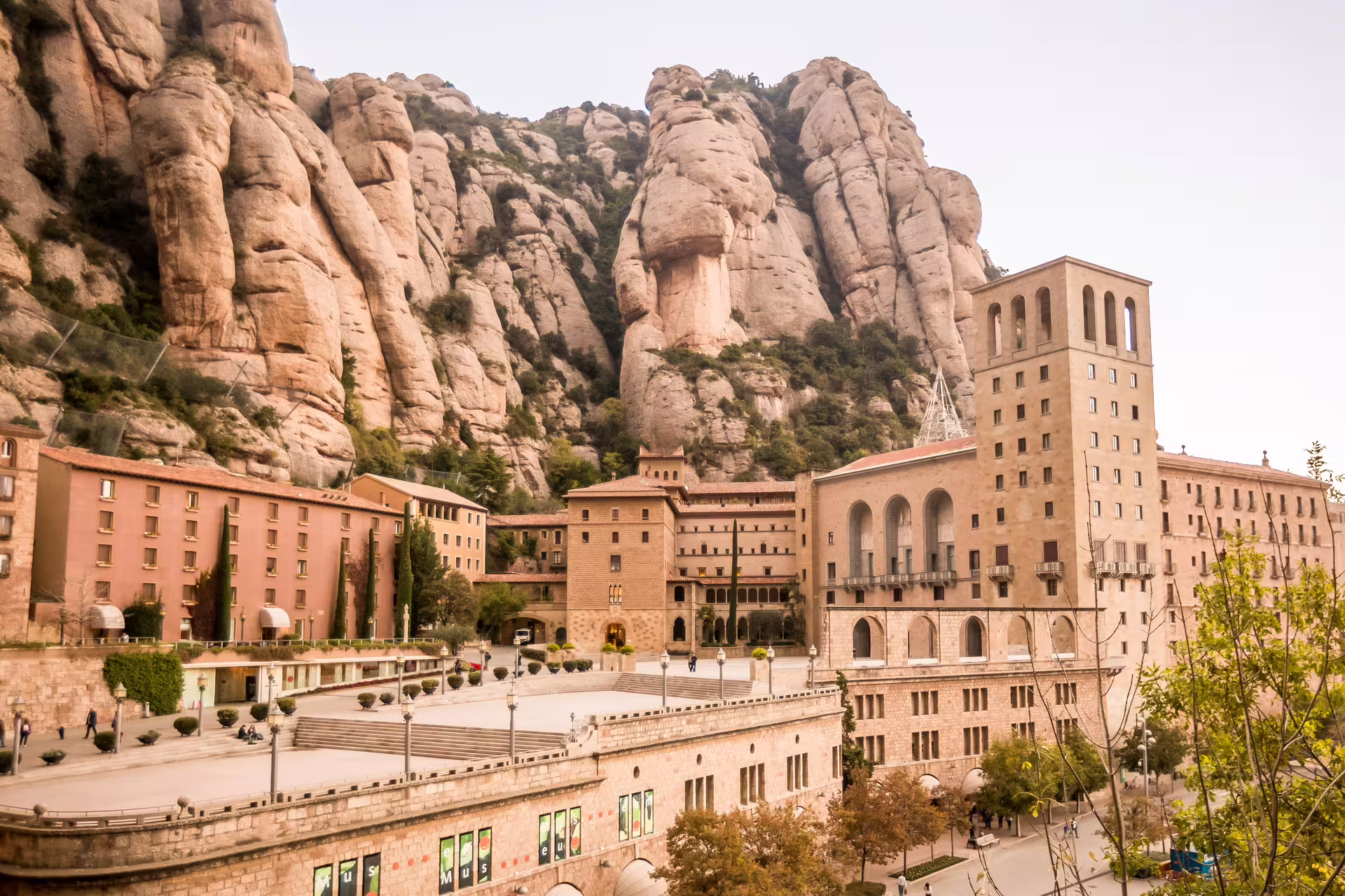 Scenic view of Montserrat Monastery nestled against dramatic rock formations, ideal for cultural food and wine tours.