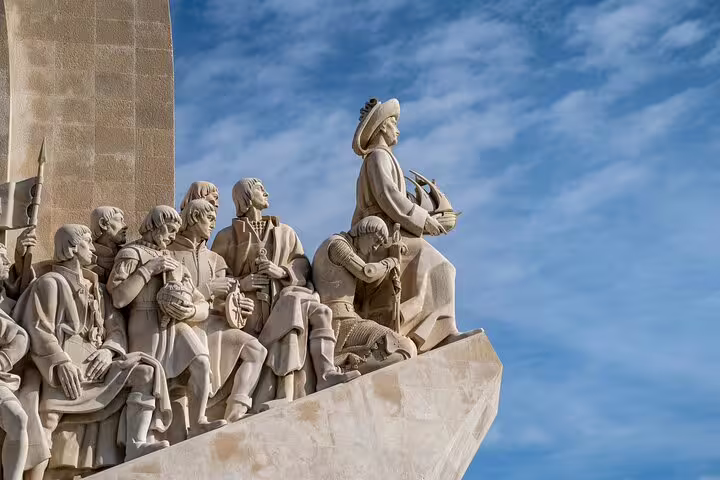 Monument of Discoveries in Belem, Lisbon, featuring historic explorers under a blue sky, ideal for a private bike tour.