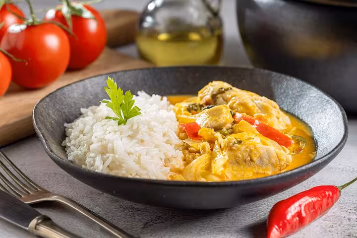 Exquisite Brazilian dish Moqueca with rice, highlighted in Rio's Cookin' Good culinary tour.