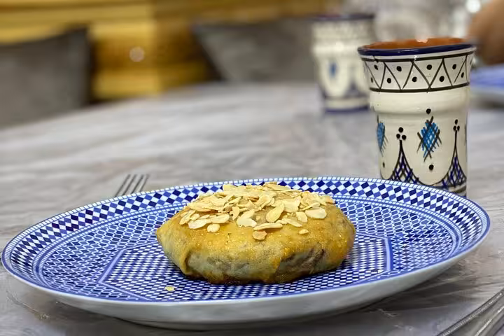 Delicious homemade Moroccan pastry with almonds on a decorative plate at Cooking Class with Yassine & Mom.
