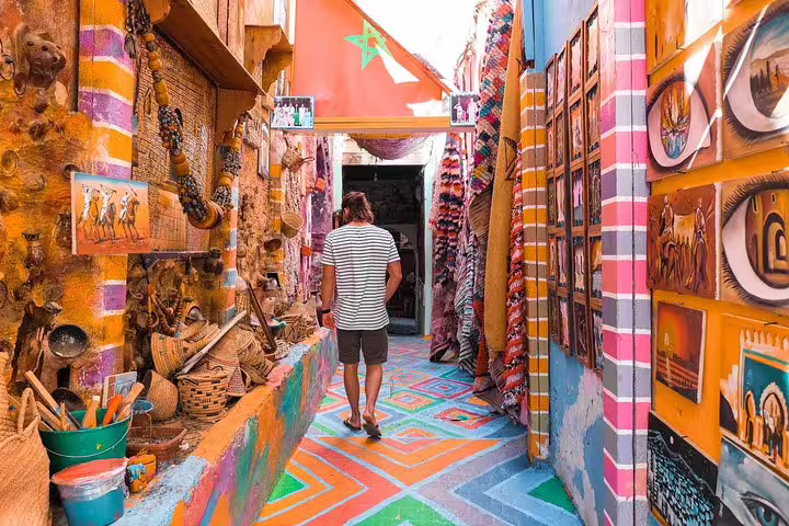 Colorful Moroccan souk lane with artisan stalls, highlight of Morocco 12 days 11 night desert tour from Agadir