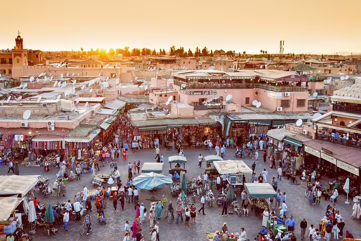 Sunset over Jemaa el-Fnaa square in Marrakech medina, a highlight on Morocco 12 days tour from Casablanca