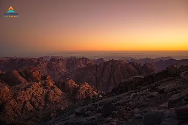 Sunrise over Sinai peaks from Moses Mountain summit on private overnight hike from Dahab to Mount Sinai