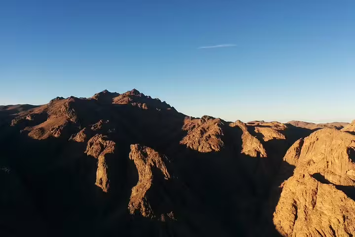 Sunrise view over Sinai mountains on the overnight Moses Mountain hike from Dahab, Egypt desert landscape