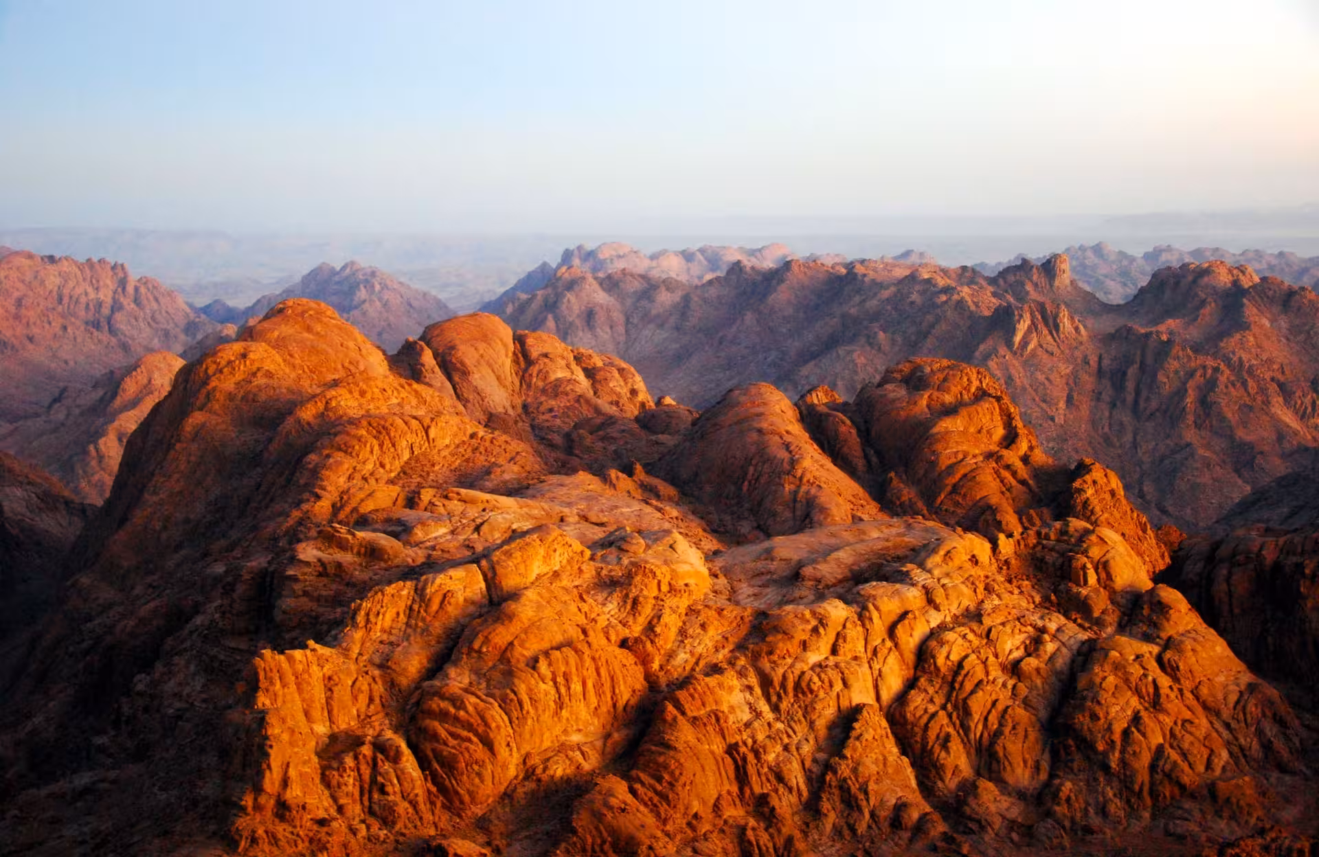 Sunrise over Moses Mountain in Sinai, Egypt, panoramic rugged peaks on St. Katharine day tour hike