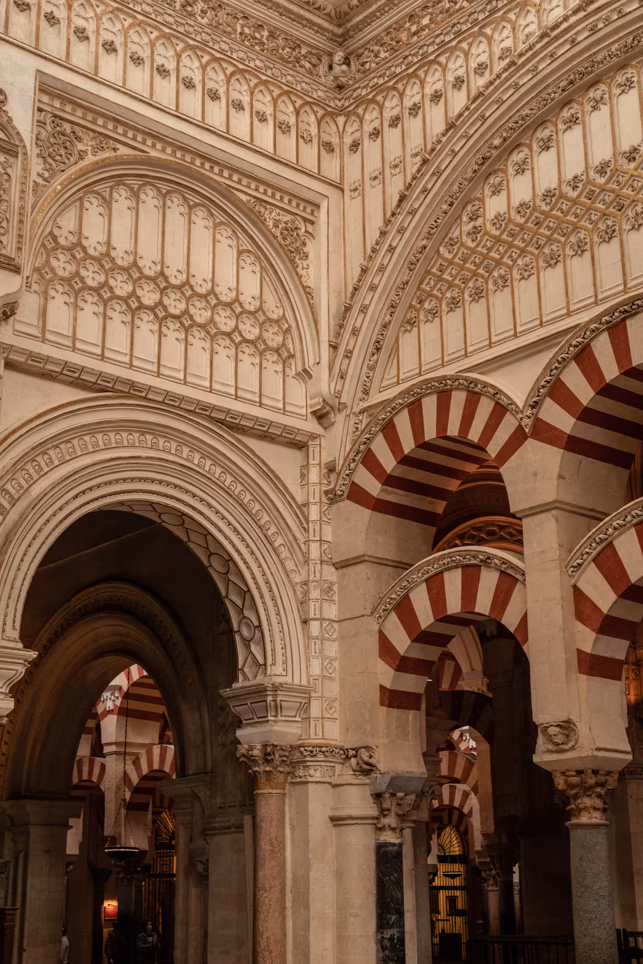 Intricate arches and ornate details of the Mosque-Cathedral's interior highlight its stunning architectural fusion.