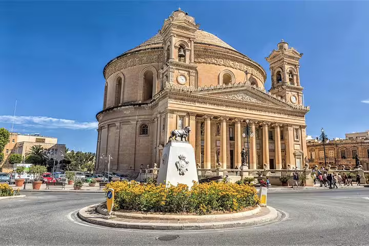The majestic Mosta Basilica under a clear blue sky, a highlight of Malta's small group tours.