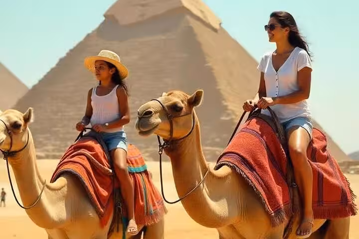 Mother and child camel ride at Giza Pyramids, Cairo, part of Giza Pyramids & Egyptian Museum tour