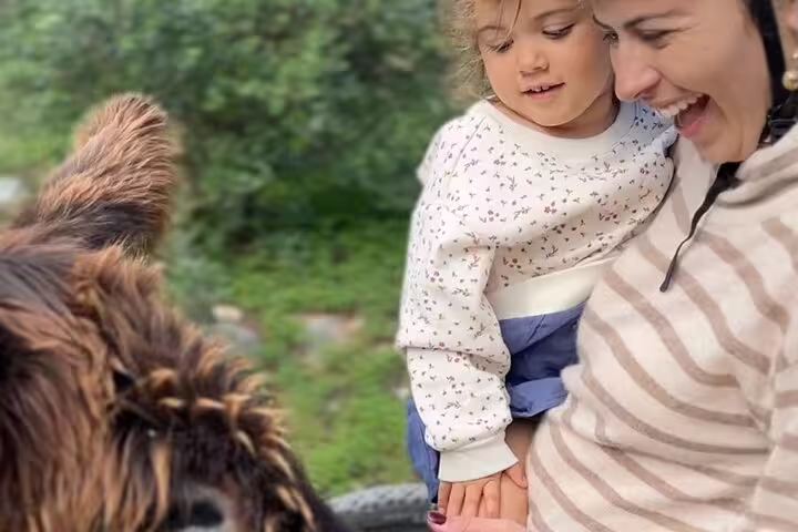 Mother and child delighting in nature encounter during the Sintra to Cascais e-bike tour.