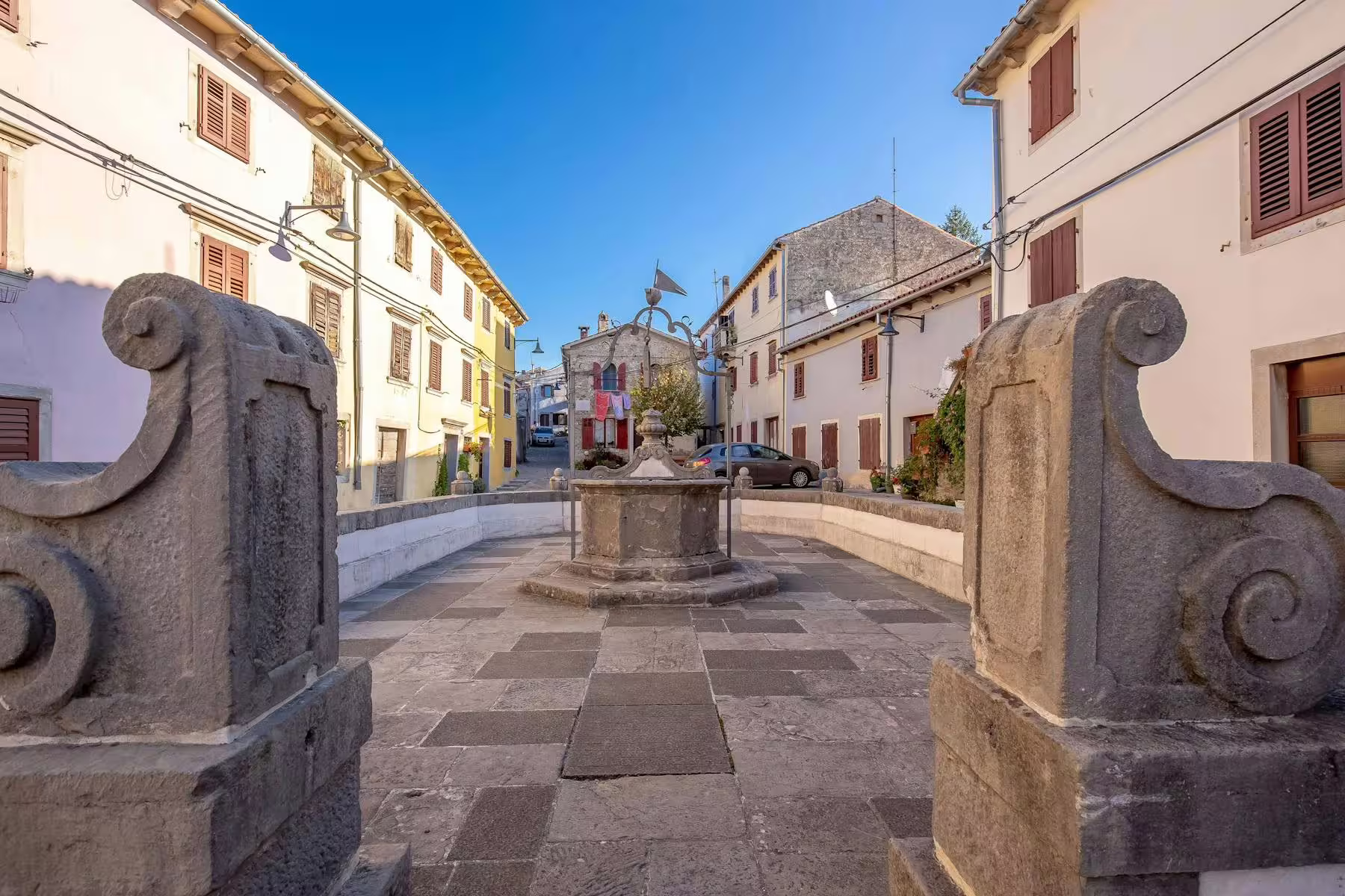 Stone square and fountain in Motovun, Istria, on half-day trip featuring truffle tasting and local brandies