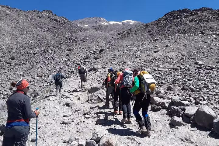 Private Mount Ararat trekking group climbing rocky scree slope with guides on 7-day all-inclusive tour