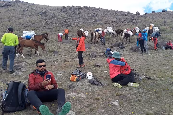 Trekking group resting with pack horses on Mount Ararat route during an all-inclusive 7-day private climb