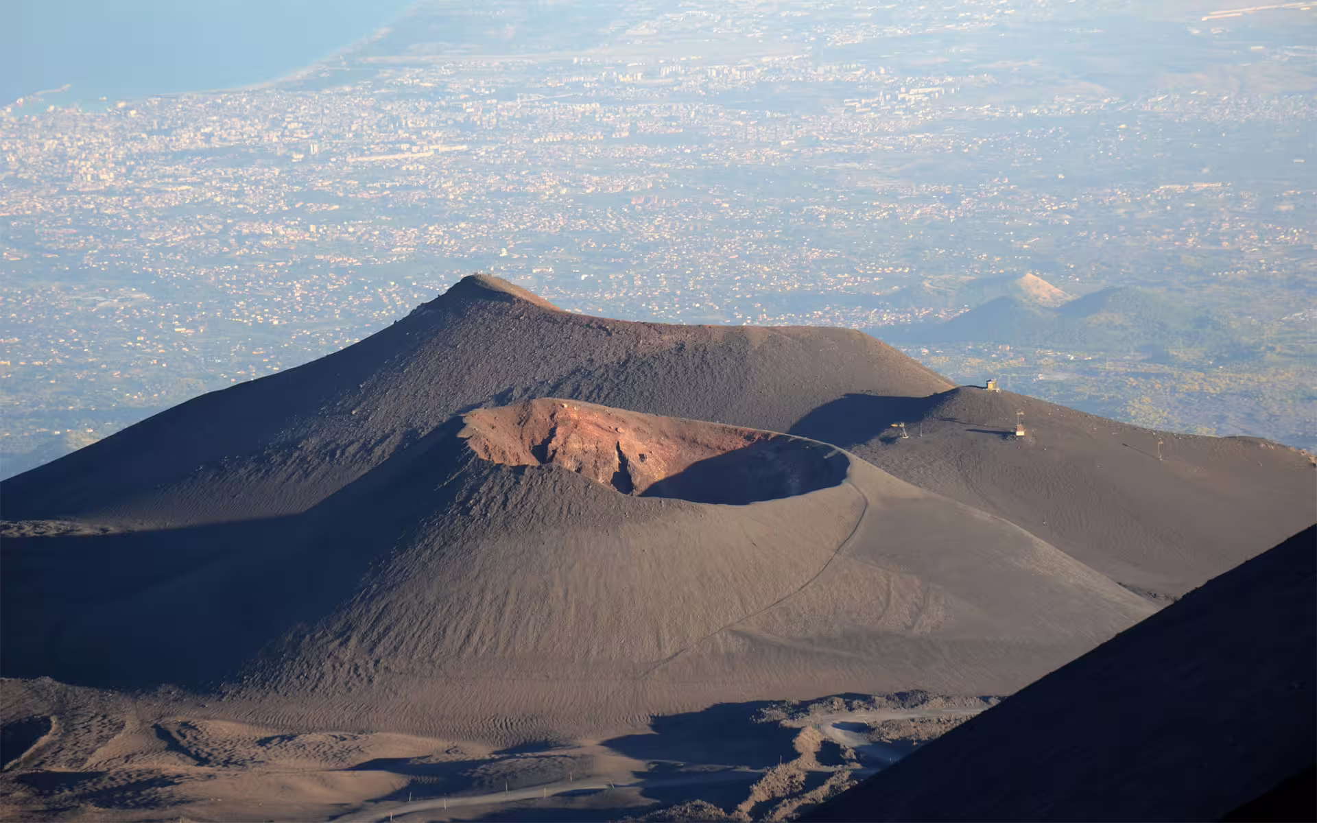 Mount Etna crater and lava slopes with panoramic view toward Catania, highlight of small group tour