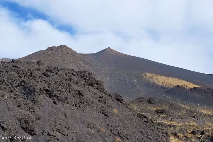 Close-up of Mount Etna's rocky slopes highlighting its volcanic landscape and steep peaks.