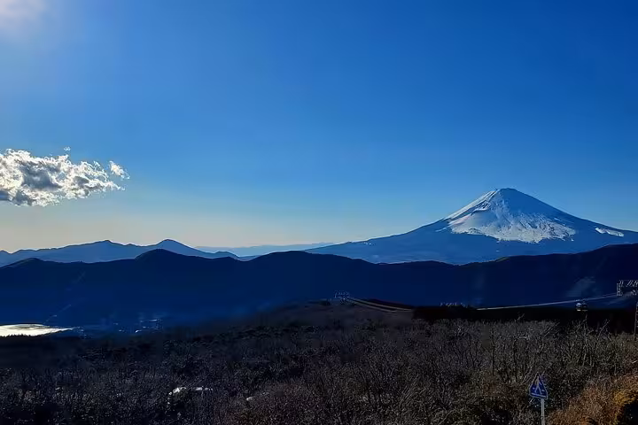 Stunning view of Mount Fuji under a clear blue sky on the Tokyo to Hakone Customizable English Guided Private Tour.