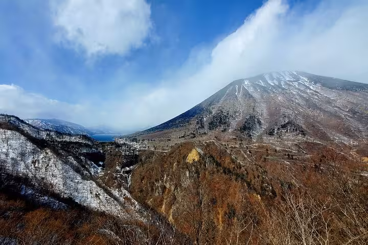Breathtaking view of Mount Nantai's snowy peaks and lush valleys on a Tokyo to Nikko private guided tour.