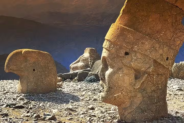 Ancient Mount Nemrut stone head statue at sunrise, featured on a private guided all-inclusive Mesopotamia tour