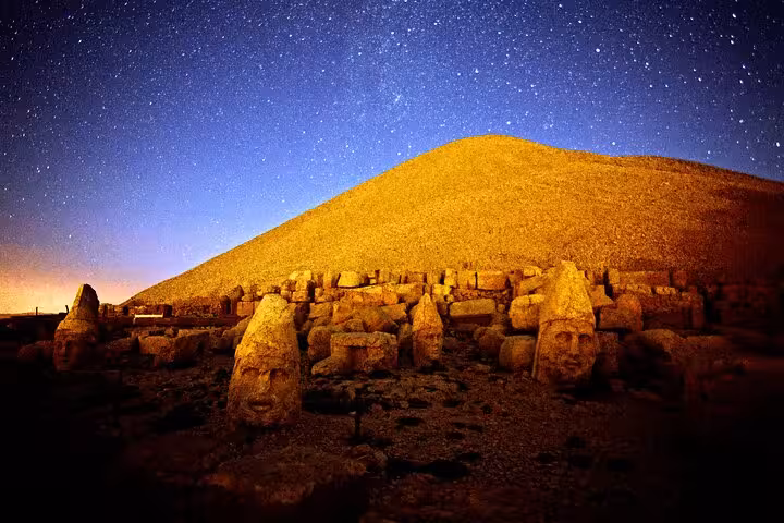 Mount Nemrut summit statues under starry sky, iconic Mesopotamia highlight on private 9-day Cappadocia tour