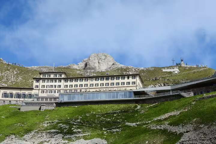 Historic mountaintop hotel on Mount Pilatus offering stunning views, featured in Lucerne private daily trip.