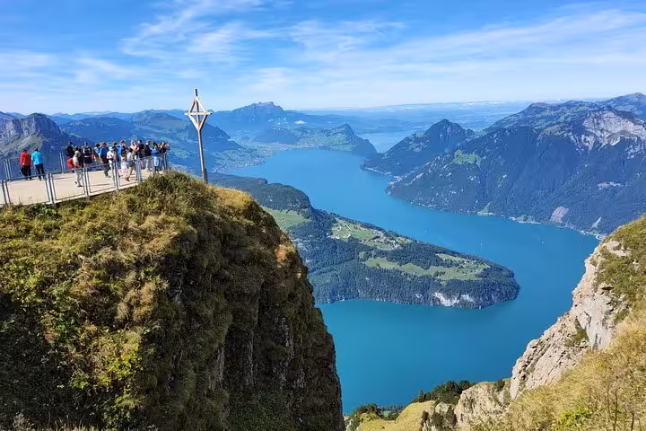 Visitors on Mount Rigi cliff platform above Lake Lucerne, Zurich day trip featuring steepest funicular