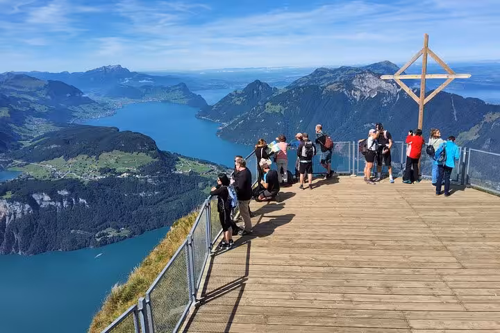 Visitors on Mount Rigi viewing platform above Lake Lucerne, part of Zurich day trip with world’s steepest funicular
