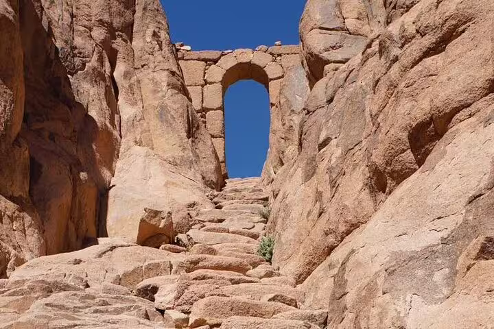 Stone steps leading to ancient archway on Mount Sinai hike, Moses’ Mountain route near St. Catherine