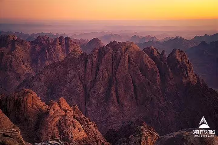 Sunrise panorama from Mount Sinai Moses Mountain hike, rugged Sinai peaks near St Catherine Monastery tour