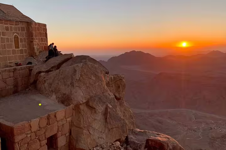 Sunrise view from Mount Sinai peak beside chapel, part of private climb and St Catherine Monastery tour