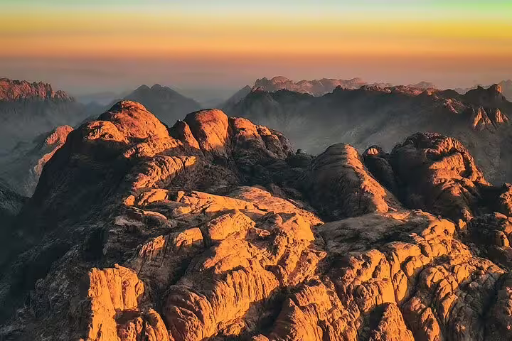 Sunrise over Mount Sinai peaks on a private climb from Sharm El Sheikh, dramatic Sinai desert panorama