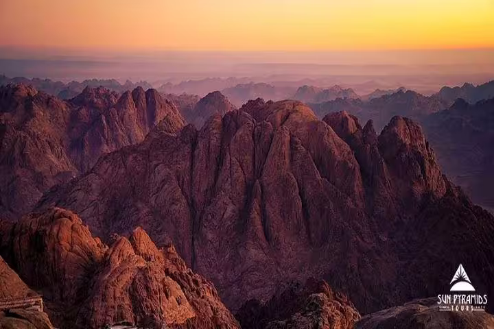 Panoramic sunrise over Mount Sinai peaks, scenic view on private overnight tour from Cairo to Saint Catherine