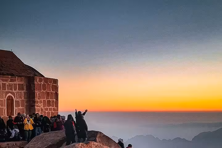 Pilgrims gather at Mount Sinai chapel at dawn on Sharm El Sheikh tour to St Catherine’s Monastery