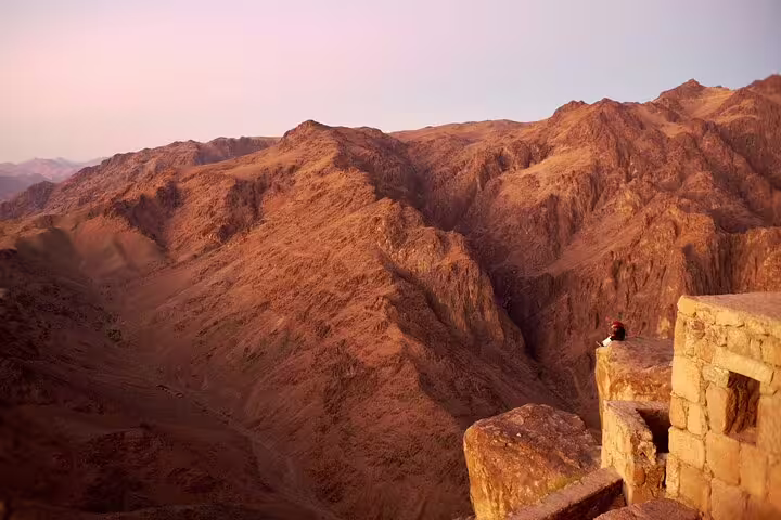 Sunset view from Mount Sinai Moses Mountain hike overlooking rugged Sinai peaks near St. Catherine