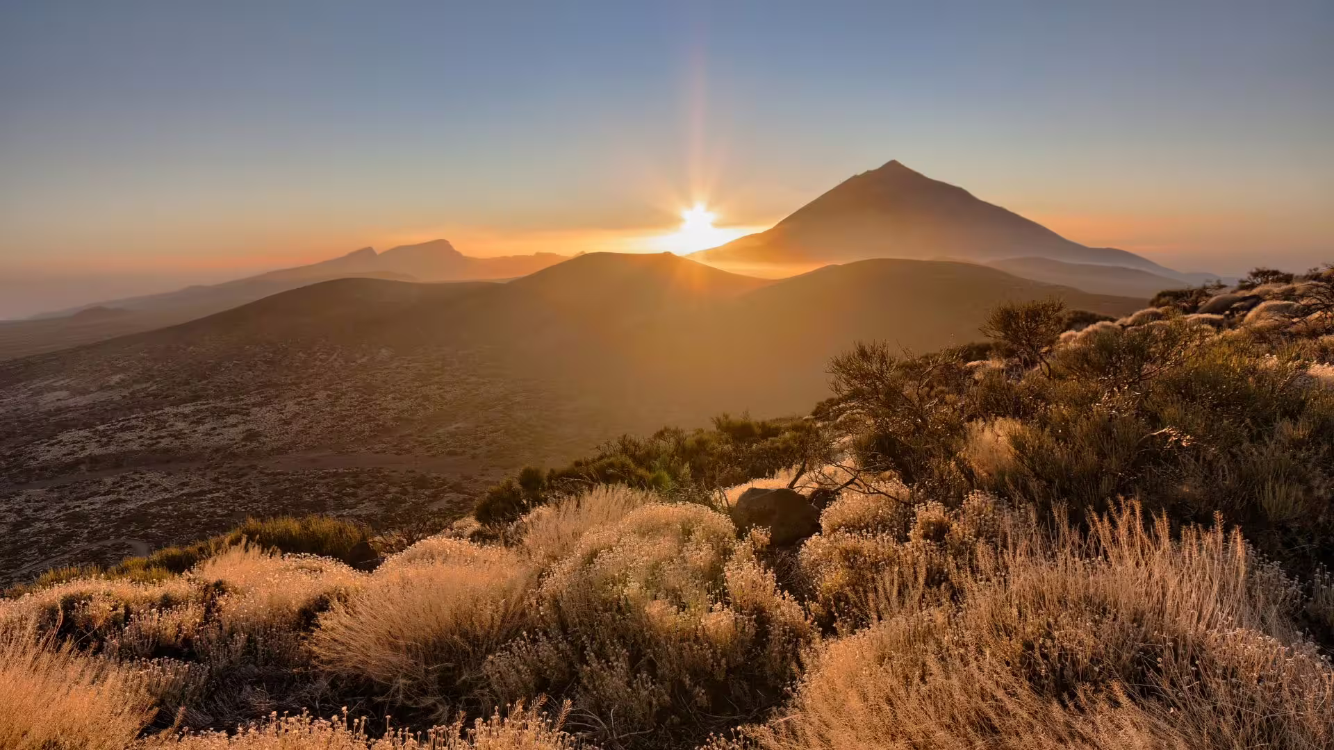 Capture the breathtaking sunset over Mount Teide, offering a serene view perfect for a private cruise excursion.