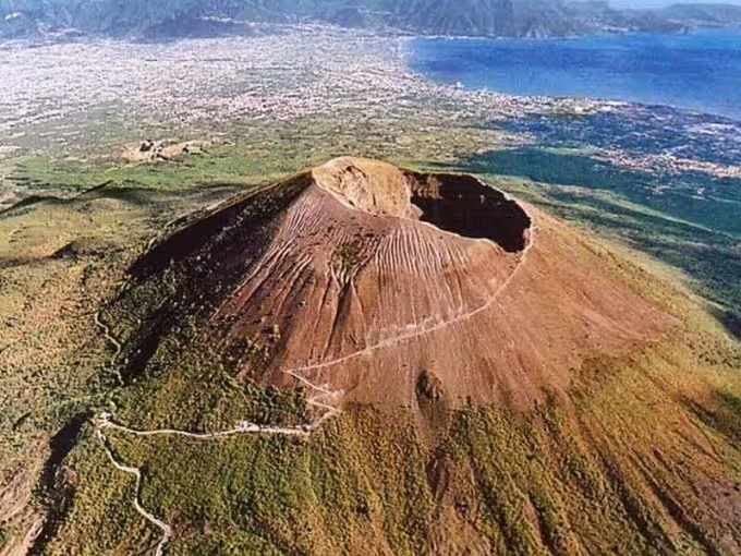 Aerial view of Mount Vesuvius crater above Bay of Naples on Pompeii & Vesuvius day tour from Naples