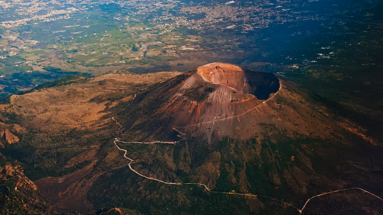 Panoramic aerial of Mount Vesuvius volcano crater above Naples, scenic stop on Vesuvius winery tour
